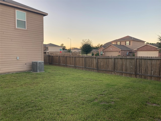 yard at dusk with central AC