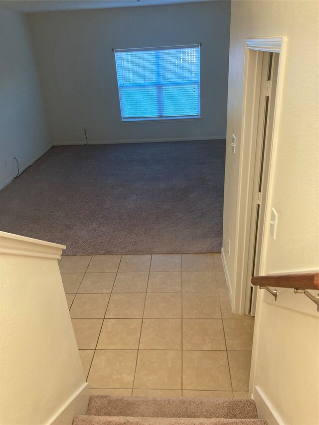 interior space featuring light tile floors