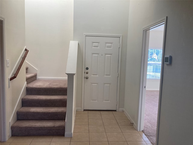 view of carpeted entrance foyer