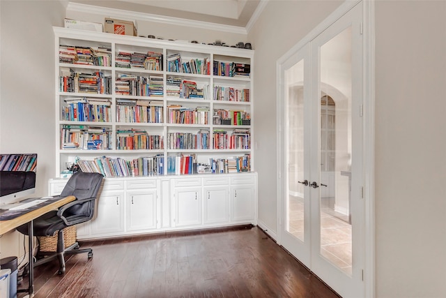 office featuring french doors, crown molding, and dark wood-type flooring