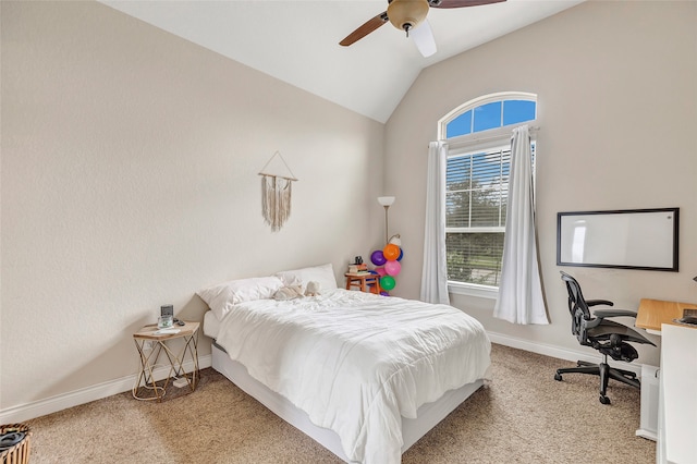 bedroom featuring ceiling fan, light colored carpet, and vaulted ceiling