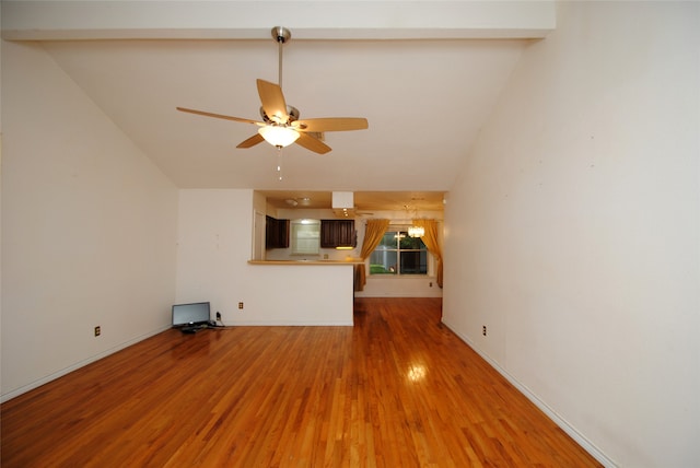 unfurnished living room with vaulted ceiling with beams, ceiling fan, and hardwood / wood-style flooring