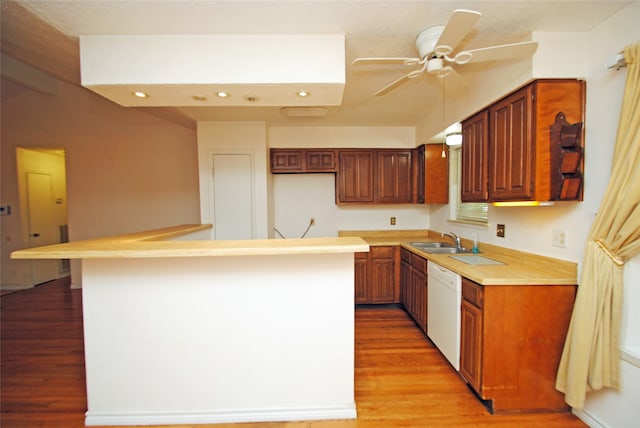 kitchen with dishwasher, ceiling fan, sink, and light hardwood / wood-style flooring