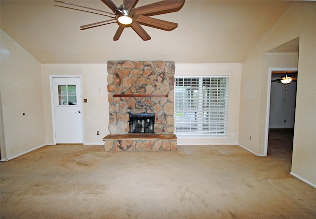 unfurnished living room with light carpet, a fireplace, ceiling fan, and lofted ceiling