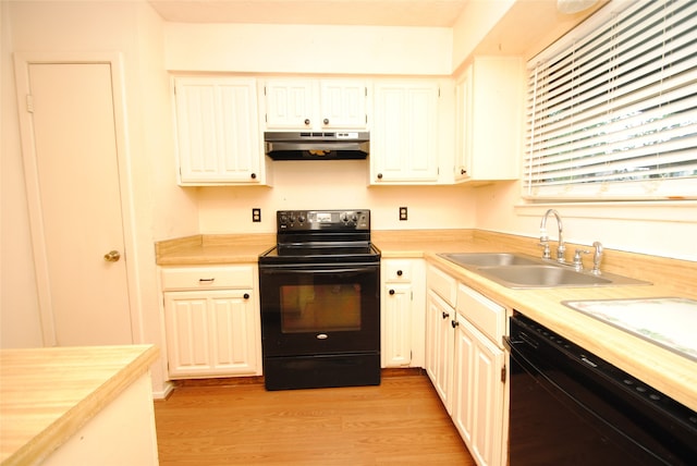 kitchen with white cabinetry, light wood-type flooring, sink, and black appliances