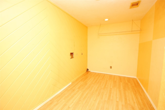 empty room with light hardwood / wood-style flooring