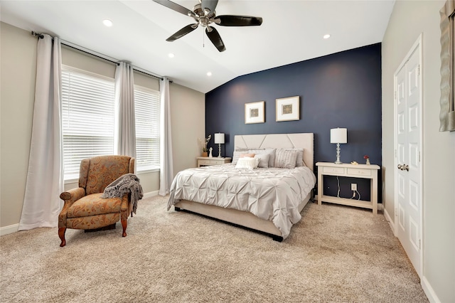 carpeted bedroom featuring vaulted ceiling and ceiling fan