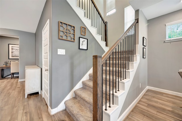 stairway featuring hardwood / wood-style flooring