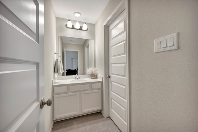 bathroom with vanity and tile patterned flooring