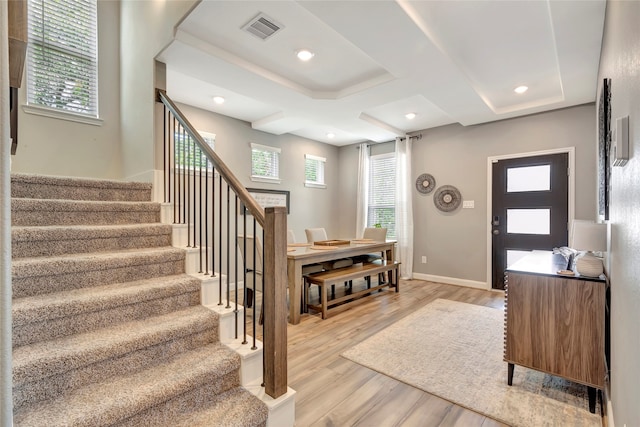 foyer entrance with a healthy amount of sunlight and light hardwood / wood-style floors