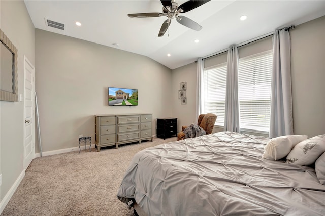 carpeted bedroom with vaulted ceiling and ceiling fan