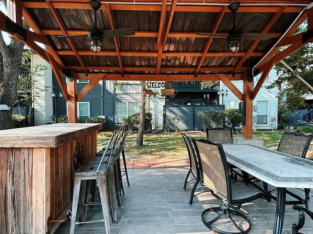 view of patio featuring a gazebo, an outdoor bar, and ceiling fan