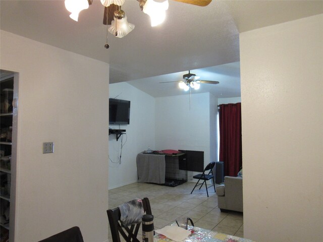 dining area with ceiling fan and light tile floors