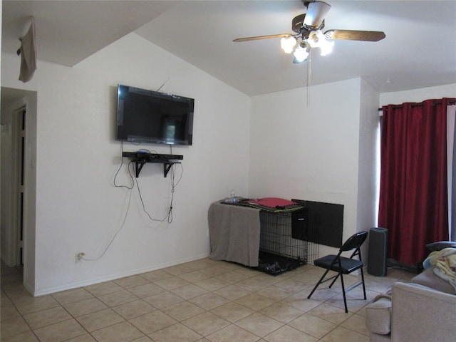 office featuring light tile floors, ceiling fan, and vaulted ceiling