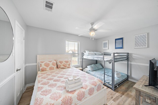 bedroom featuring ceiling fan and hardwood / wood-style flooring