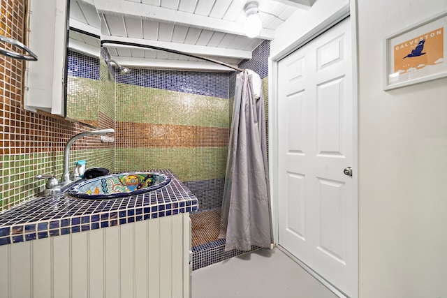 bathroom with vanity, tasteful backsplash, wooden ceiling, and lofted ceiling with beams