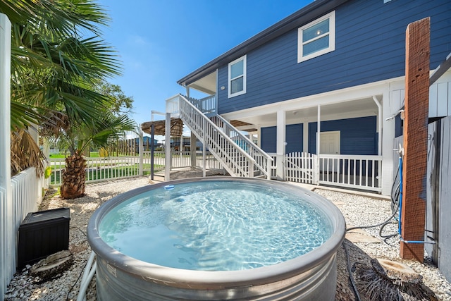 view of swimming pool with a deck