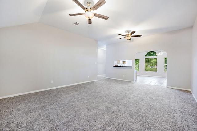 unfurnished room featuring lofted ceiling, light colored carpet, and ceiling fan