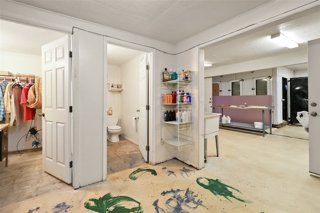 interior space with toilet, tile flooring, and vanity