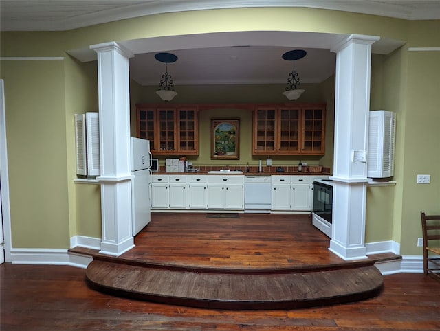 kitchen featuring dark hardwood / wood-style flooring, white cabinets, white appliances, and hanging light fixtures