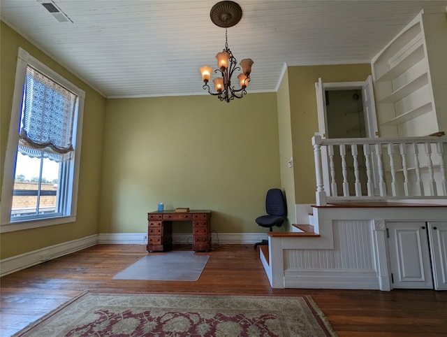 interior space with ornamental molding, a notable chandelier, and dark wood-type flooring