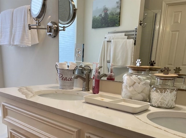 bathroom featuring dual vanity and walk in shower