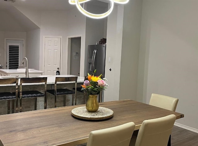 dining space featuring dark hardwood / wood-style flooring