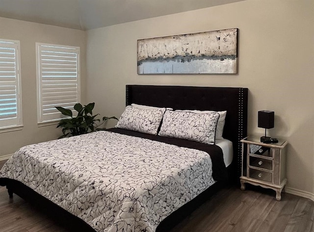 bedroom featuring dark wood-type flooring