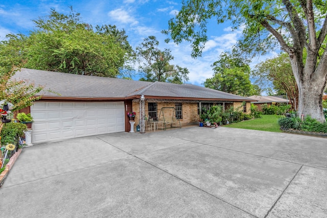 ranch-style house featuring a garage