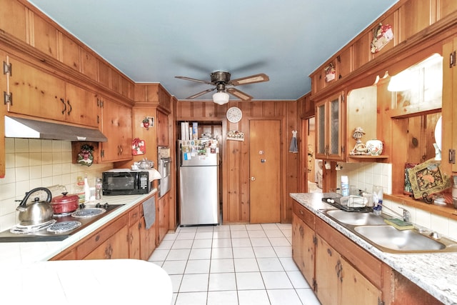 kitchen with backsplash, premium range hood, stainless steel appliances, and ceiling fan