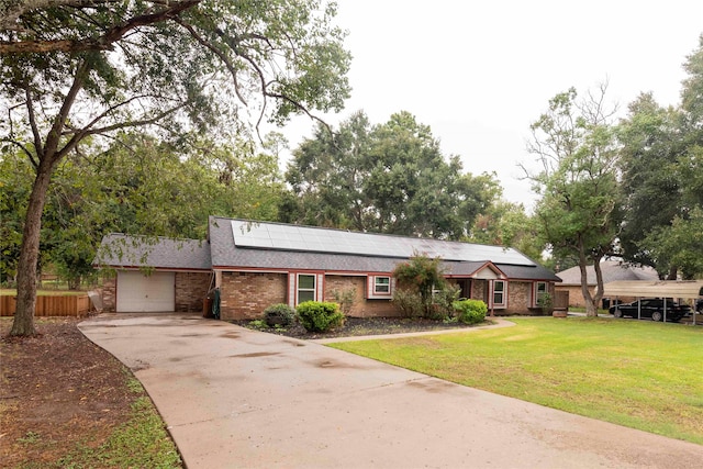 ranch-style house with solar panels and a front lawn