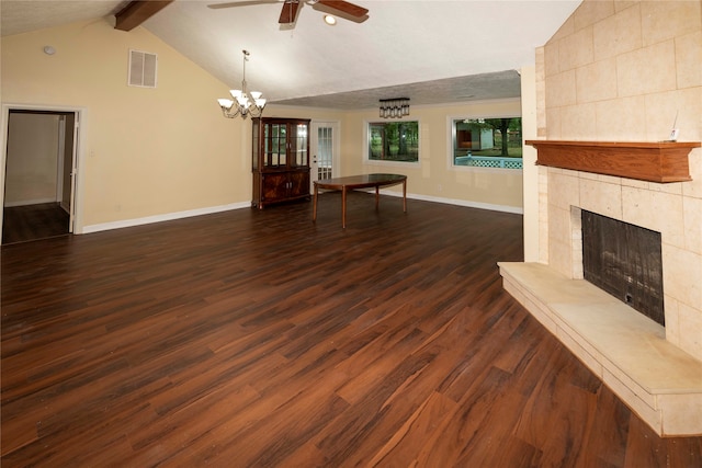 unfurnished living room with a tiled fireplace, dark hardwood / wood-style flooring, and ceiling fan with notable chandelier