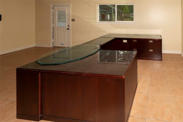 kitchen featuring light tile floors