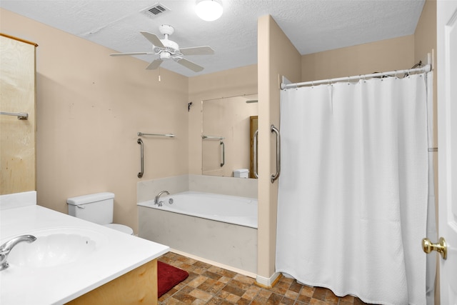 bathroom featuring tile patterned flooring, toilet, vanity, ceiling fan, and a bath