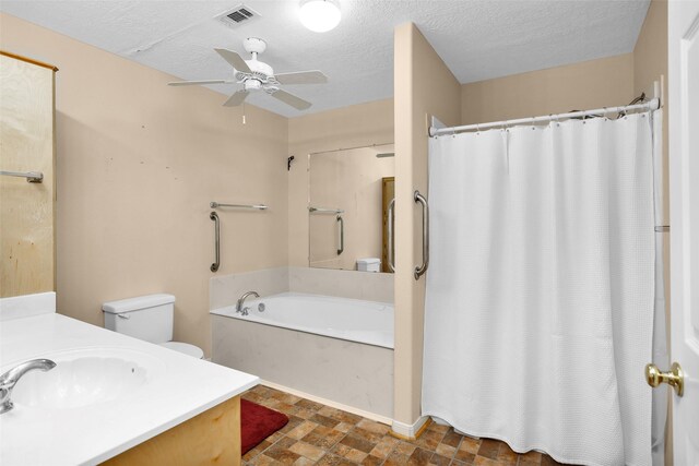 351 Trinity Dr, Trinity, TX 75862 - bathroom with visible vents, vanity, a textured ceiling, a tub to relax in, and a ceiling fan