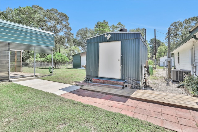 351 Trinity Dr, Trinity, TX 75862 - view of shed featuring central air condition unit and fence