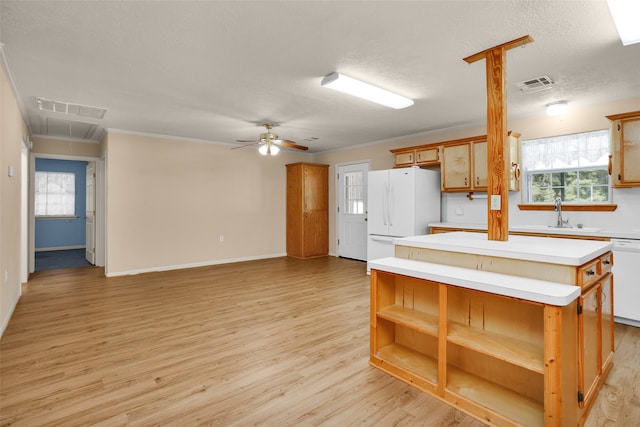 kitchen featuring sink, light hardwood / wood-style flooring, ceiling fan, and white appliances