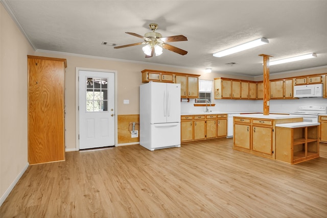 kitchen with light hardwood / wood-style flooring, white appliances, a kitchen island, and ceiling fan