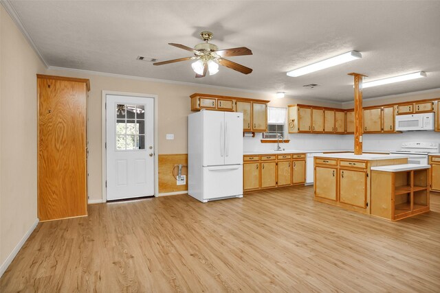351 Trinity Dr, Trinity, TX 75862 - kitchen featuring a ceiling fan, visible vents, light countertops, light wood finished floors, and white appliances