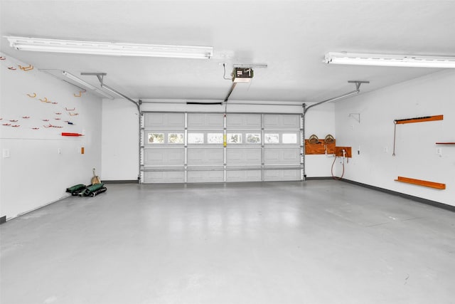 351 Trinity Dr, Trinity, TX 75862 - garage featuring a garage door opener