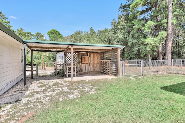 351 Trinity Dr, Trinity, TX 75862 - view of yard with an outdoor structure and a gate