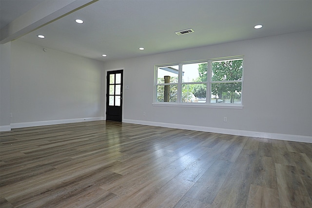 spare room featuring hardwood / wood-style floors