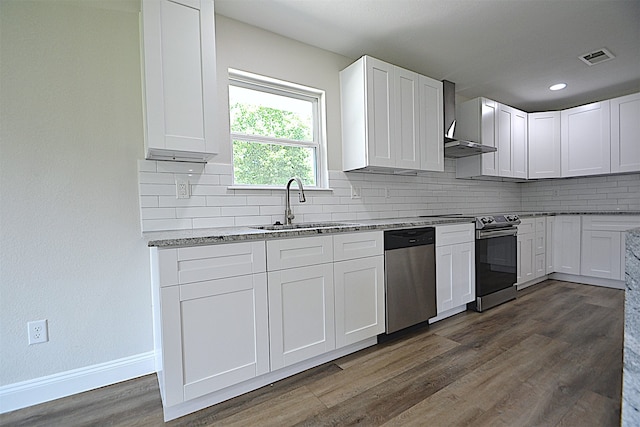 kitchen featuring dark hardwood / wood-style flooring, dishwasher, decorative backsplash, and stove