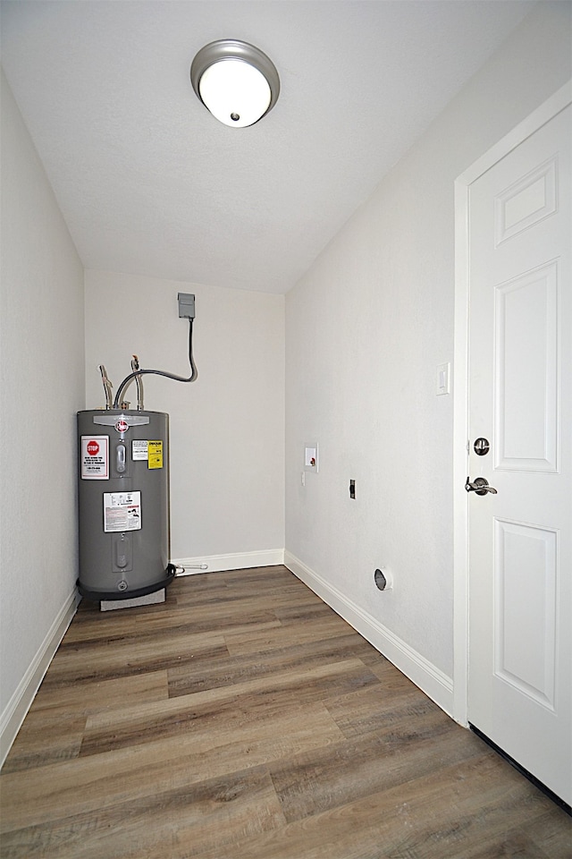 utility room with electric water heater