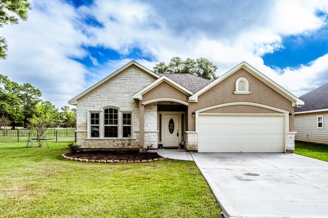 view of front of property featuring a front yard and a garage