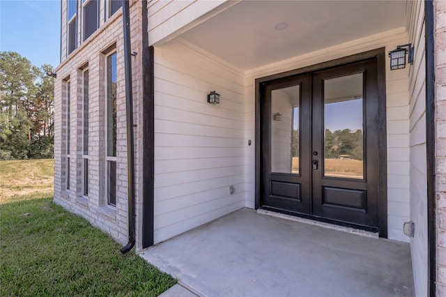 entrance to property featuring french doors