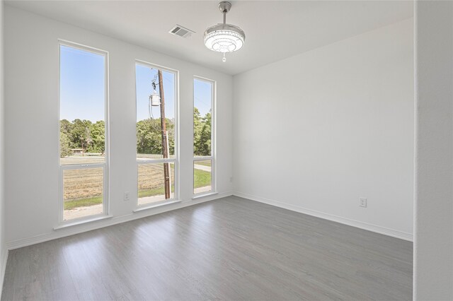 spare room with dark hardwood / wood-style flooring