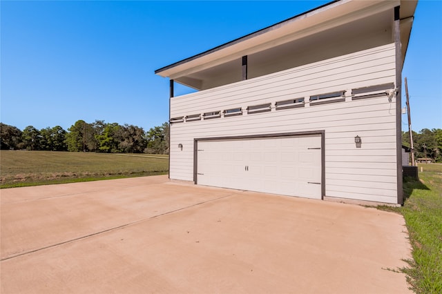 garage with a lawn