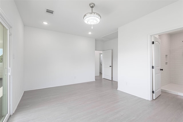 unfurnished room featuring light wood-type flooring