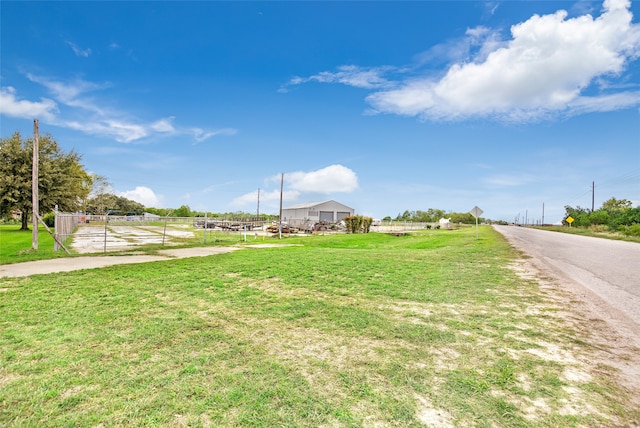 exterior space with a front yard and a rural view